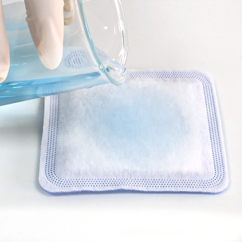 Blue SAP dressing core absorbing large amounts of wound fluid