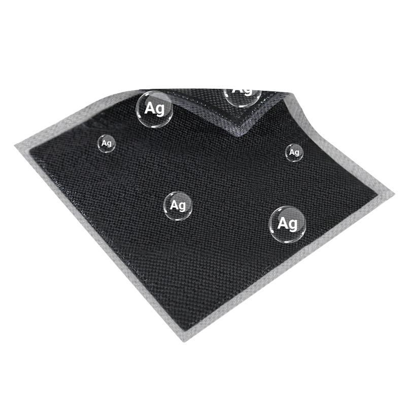 Unfolded Silver Activated Charcoal Dressing showing layered structure and non-adhesive design