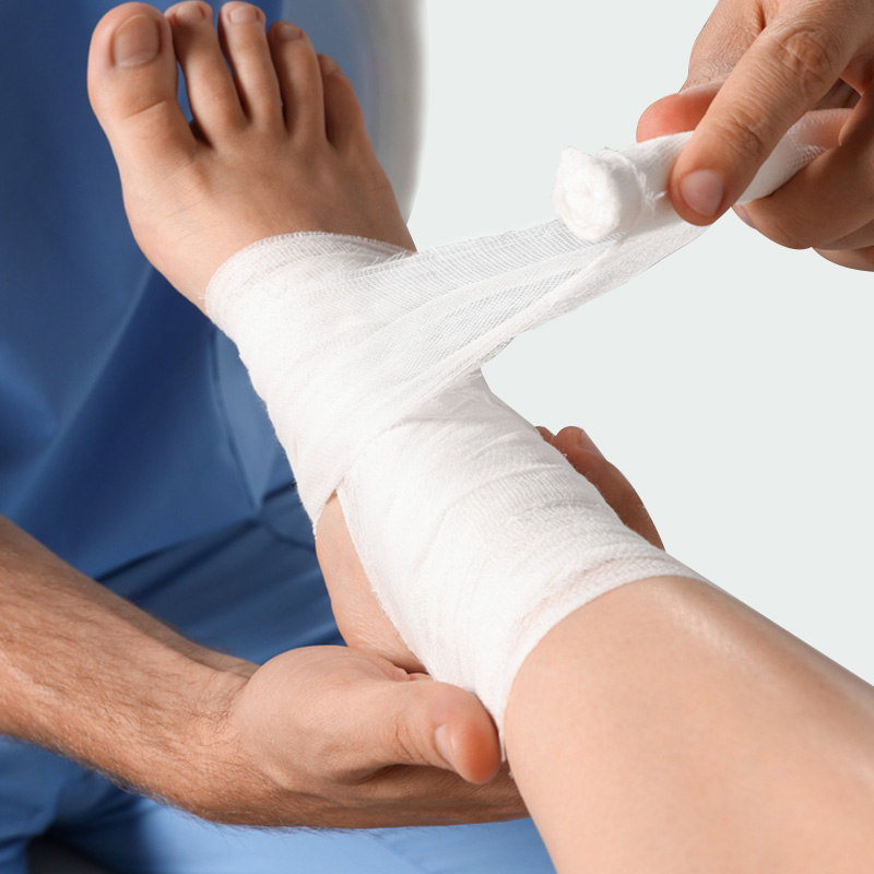 Close-up of PBT Bandage being stretched and wrapped snugly around wrist or ankle