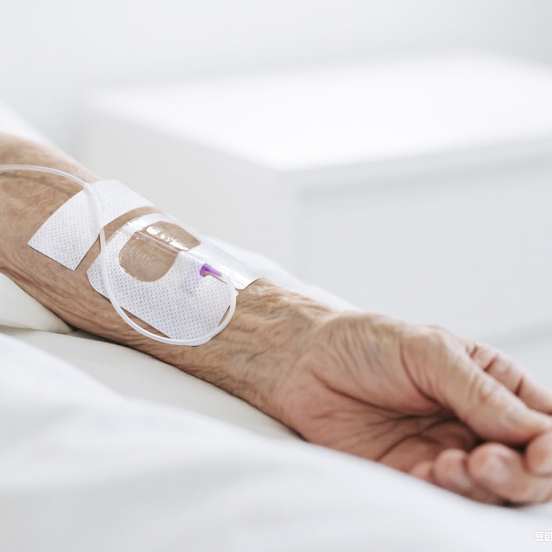 Close look at breathable I.V. dressing on skin with airflow lines, indicating ventilation