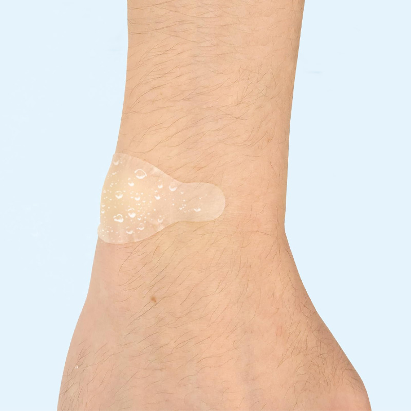 Hydrocolloid Bandage applied to finger or knee, repelling water droplets